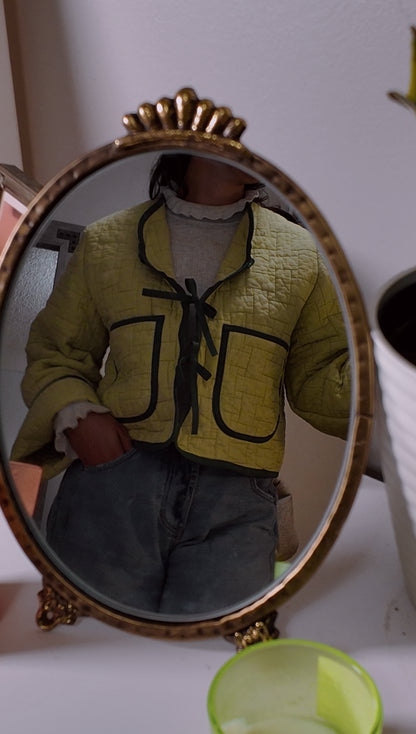 Wavy jacket with bow closures